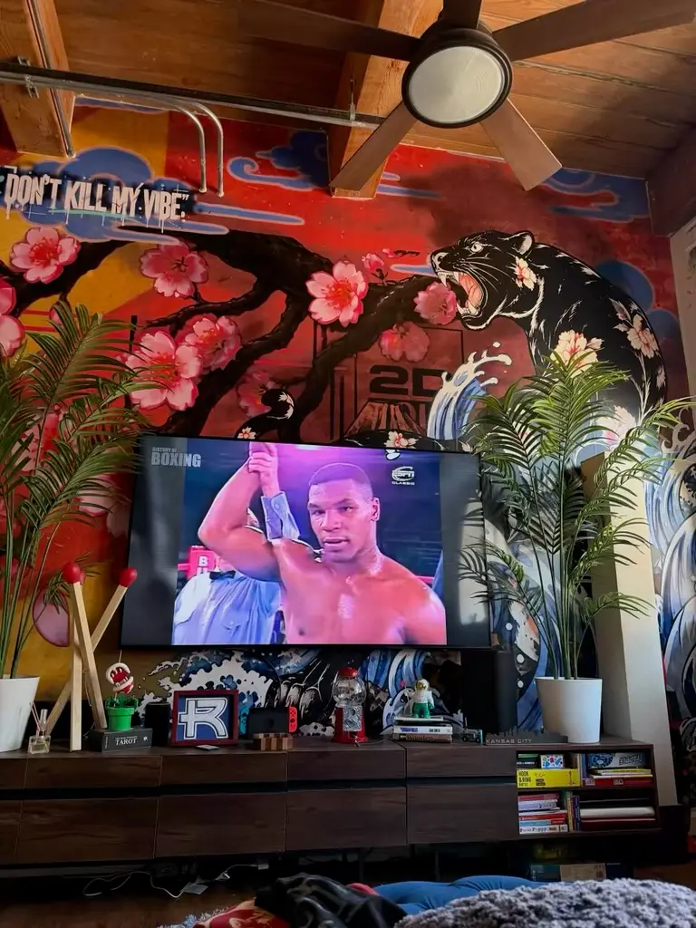 Cherry blossom and panther wall mural in a living room