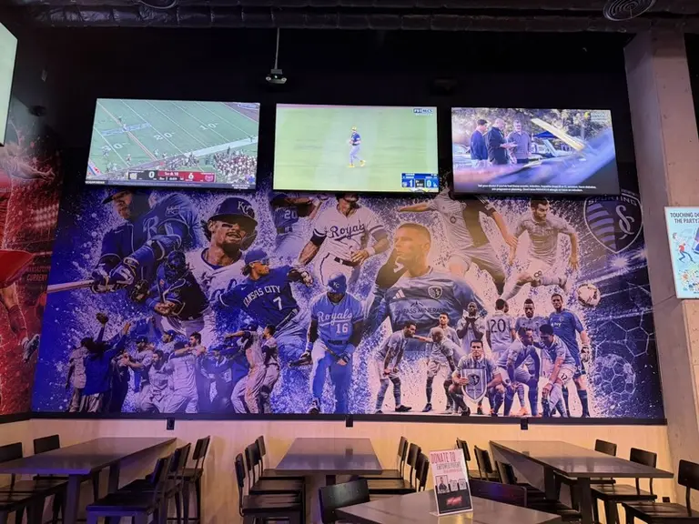 Kansas City sports mural on a sports bar wall